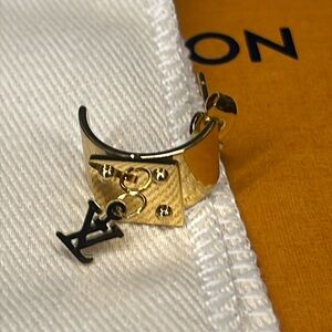 LV style gold tone huggie earring